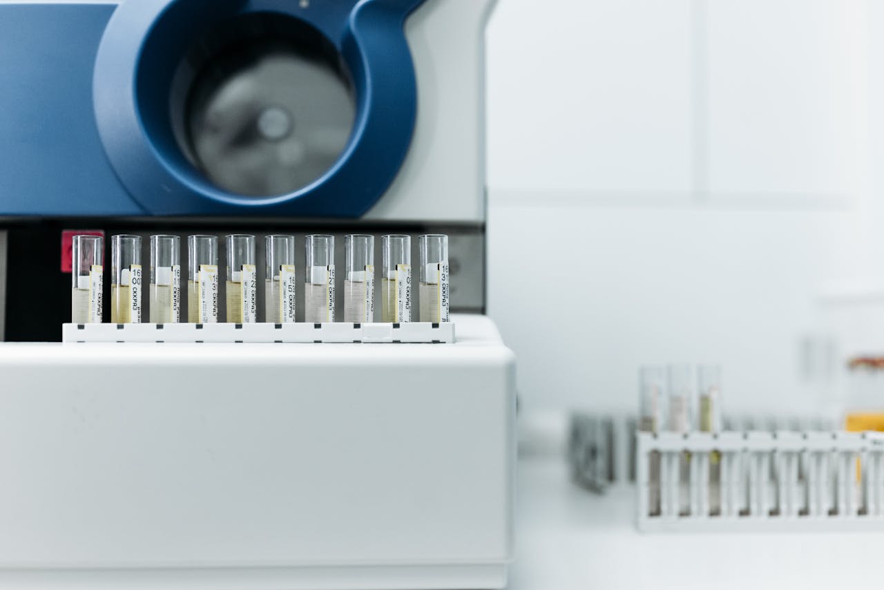 Detailed image of laboratory equipment with rows of test tubes ready for analysis.